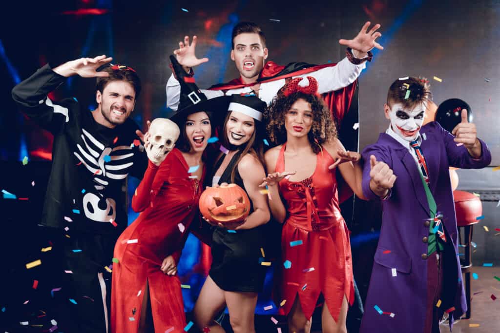 Group of men and women in halloween costumes