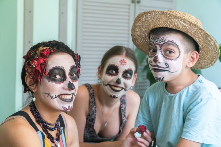 family wearing face paint for Day of the Dead